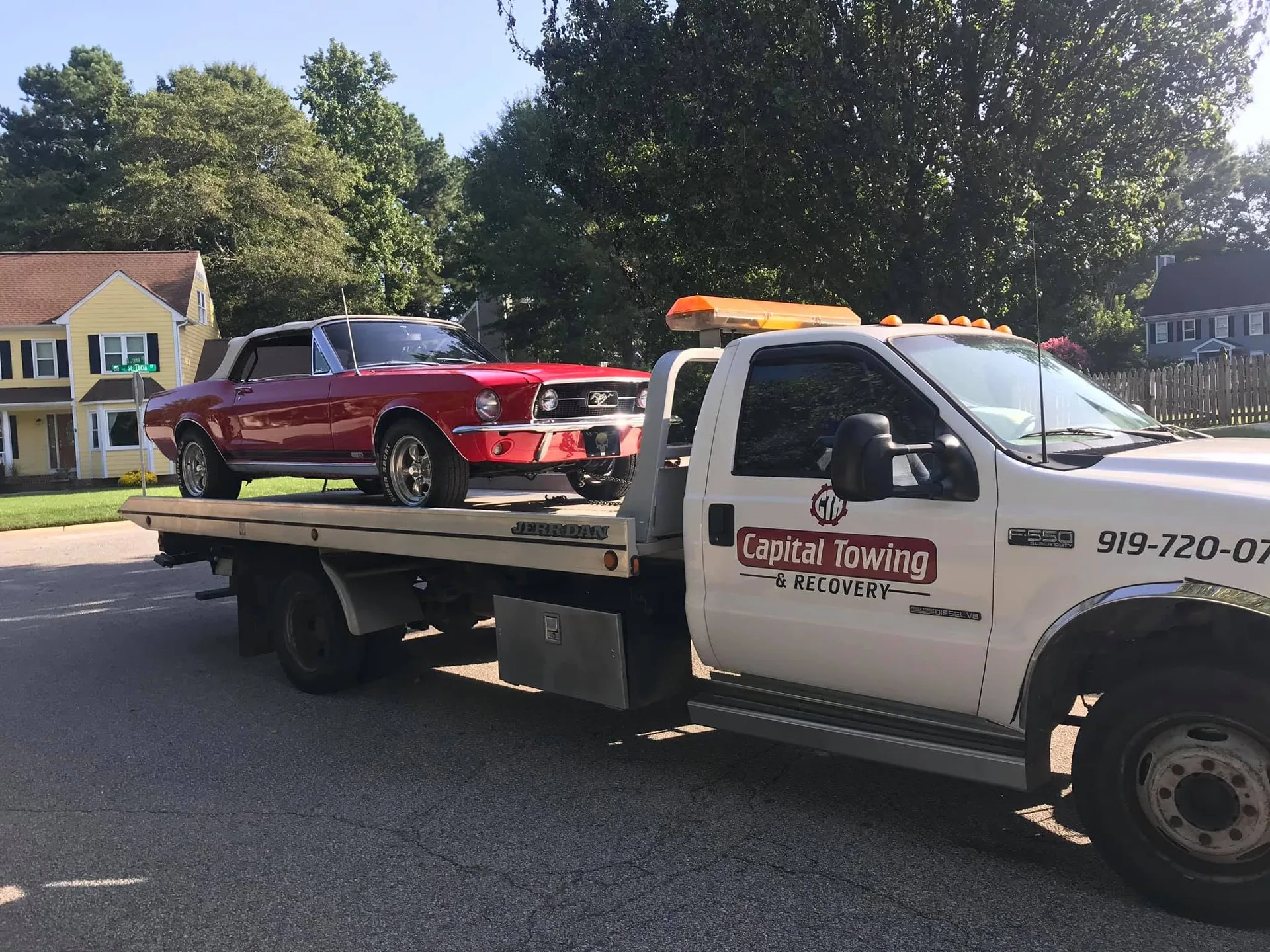 Red classic Mustang convertible on the flatbed